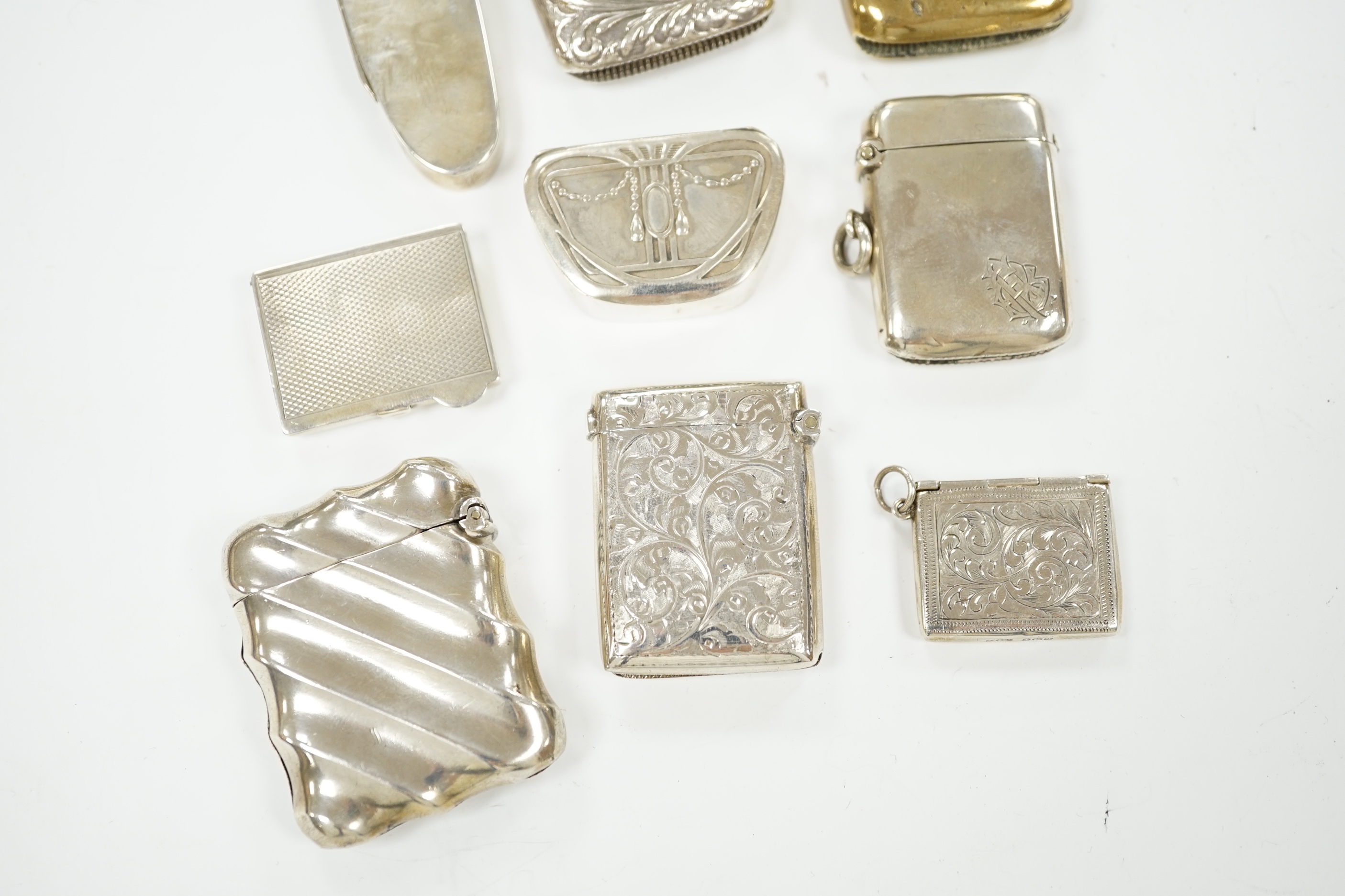 Five assorted silver vesta cases, including Victorian oval by Sampson Mordan, 72mm, a brass and enamel 'It all Ends In' vesta case, two pill boxes and a silver 'envelope' stamp case.